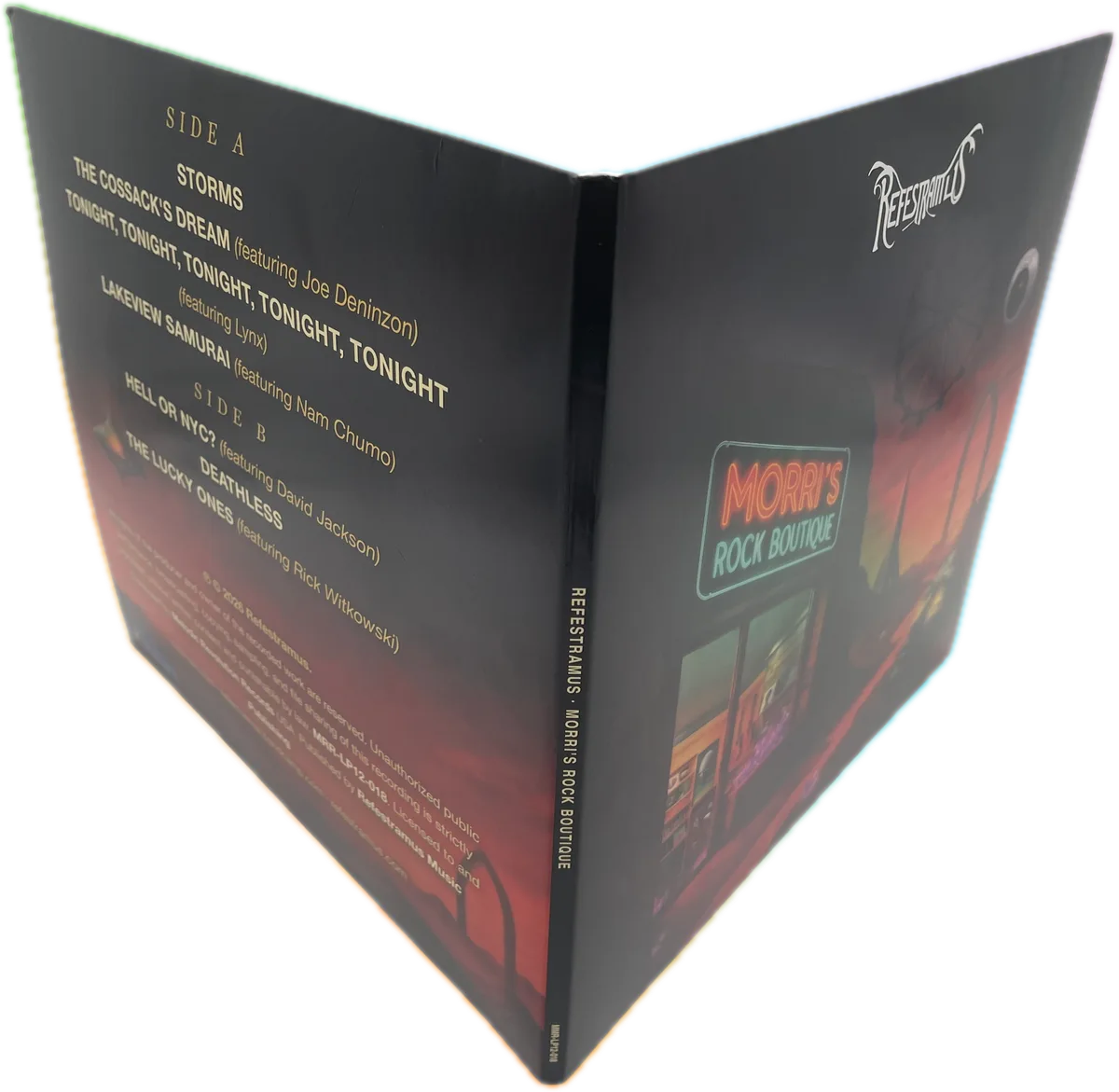 The sleeve standing open, showing the back cover track listing and the spine